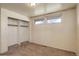 This bedroom features neutral walls, carpeted floors, and a built-in closet to maximize storage space at 41 Cortez St, Denver, CO 80221