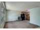 Cozy living room features neutral carpet, bright windows, and an open layout to the kitchen at 41 Cortez St, Denver, CO 80221