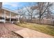 Large backyard featuring a stone walkway, patio, and lush lawn at 16308 E Wyoming Dr, Aurora, CO 80017