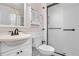 Bright bathroom with a shower featuring an opaque glass door, and modern fixtures at 16308 E Wyoming Dr, Aurora, CO 80017