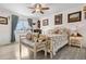 Bright bedroom featuring hardwood floors, natural light, and antique-style furnishings at 16308 E Wyoming Dr, Aurora, CO 80017