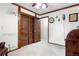 Bedroom featuring wooden trim, ceiling fan and a large closet at 16308 E Wyoming Dr, Aurora, CO 80017