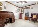 Bedroom featuring wooden desk, phone booth, and vintage furniture at 16308 E Wyoming Dr, Aurora, CO 80017