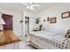 Cozy bedroom featuring a comfortable bed and closet with vintage-inspired decor at 16308 E Wyoming Dr, Aurora, CO 80017