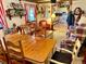 Cozy dining room area open to the kitchen with wood accents and plentiful natural light at 16308 E Wyoming Dr, Aurora, CO 80017