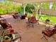 Covered patio with a flagstone floor, ample seating, and a view of the garden at 16308 E Wyoming Dr, Aurora, CO 80017