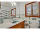 Clean bathroom with blue tile and updated vanity at 5648 E Greenwood Pl, Denver, CO 80222