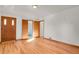 Hardwood floor bedroom with private bath access at 5648 E Greenwood Pl, Denver, CO 80222