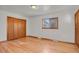 Spacious bedroom with hardwood floors and double door closet at 5648 E Greenwood Pl, Denver, CO 80222