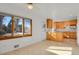 Eat-in kitchen with wood cabinets, and sunny window at 5648 E Greenwood Pl, Denver, CO 80222