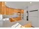 Bright kitchen with ample wood cabinets and double ovens at 5648 E Greenwood Pl, Denver, CO 80222