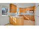 Bright kitchen with ample wood cabinets and built-in microwave at 5648 E Greenwood Pl, Denver, CO 80222