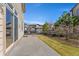Enjoy this house's well-maintained backyard with a concrete patio and lawn at 1208 S Valentia Ct, Denver, CO 80247
