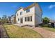 Exterior of this house with a fenced in backyard with concrete patio and well-maintained lawn at 1208 S Valentia Ct, Denver, CO 80247