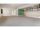 Spacious basement with new carpet, recessed lighting, and neutral paint at 1208 S Valentia Ct, Denver, CO 80247
