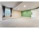 Bright finished basement featuring large windows and ample lighting at 1208 S Valentia Ct, Denver, CO 80247