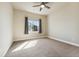 Bedroom with neutral carpet, ceiling fan, and bright window at 1208 S Valentia Ct, Denver, CO 80247