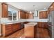 Well-lit kitchen boasts granite countertops, stainless appliances, and wood floors at 1208 S Valentia Ct, Denver, CO 80247