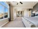 Spacious main bedroom boasts a large window, neutral carpeting, and light-filled open space at 1208 S Valentia Ct, Denver, CO 80247