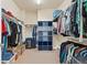 Large walk-in closet with built-in shelving and ample storage space at 1208 S Valentia Ct, Denver, CO 80247