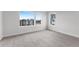 Bedroom featuring carpet and large windows that offer a view of the surrounding buildings at 14281 Currant, Broomfield, CO 80020