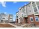 Attractive townhome showcases a blend of textures with a brick facade and stylish siding under a bright sky at 14281 Currant, Broomfield, CO 80020