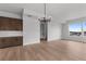 Open floor plan showcasing the transition from the kitchen to the living room with hardwood floors and modern fixtures at 14281 Currant, Broomfield, CO 80020