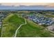 Aerial view of a neighborhood and golf course at 16198 E 111Th Pl, Commerce City, CO 80022