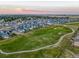 Aerial view of neighborhood near golf course at 16198 E 111Th Pl, Commerce City, CO 80022