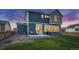 Two story home with backyard, patio, and landscaping at 16198 E 111Th Pl, Commerce City, CO 80022