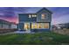 Two story home with backyard, patio, and landscaping at 16198 E 111Th Pl, Commerce City, CO 80022
