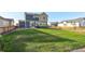Large backyard with grassy area, wooden fence, and patio at 16198 E 111Th Pl, Commerce City, CO 80022