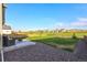 Large backyard with patio, firepit, and grassy area at 16198 E 111Th Pl, Commerce City, CO 80022
