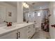 Shared bathroom with double vanity and tub shower at 16198 E 111Th Pl, Commerce City, CO 80022