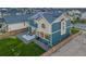 Two-story home with solar panels and fenced yard at 16198 E 111Th Pl, Commerce City, CO 80022