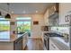 Modern kitchen with stainless steel appliances and a large island at 16198 E 111Th Pl, Commerce City, CO 80022