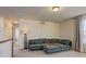 Bright loft with sectional sofa, offering a versatile space at 16198 E 111Th Pl, Commerce City, CO 80022