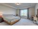 Spacious main bedroom with large window and workspace at 16198 E 111Th Pl, Commerce City, CO 80022