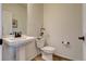 Clean powder room with pedestal sink and toilet at 16198 E 111Th Pl, Commerce City, CO 80022