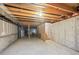 Unfinished basement offering ample space and exposed ceiling with wooden beams to customize to your desire at 11565 Decatur St # 7D, Denver, CO 80234