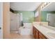 Bathroom with a large bathtub, shower, and double vanity at 11565 Decatur St # 7D, Denver, CO 80234