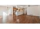 Kitchen with wood cabinets, white appliances, and a breakfast bar at 11565 Decatur St # 7D, Denver, CO 80234