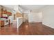 Kitchen with wood cabinets, white appliances, and breakfast bar at 11565 Decatur St # 7D, Denver, CO 80234