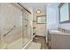 Modern bathroom with a glass-enclosed shower, sleek vanity, and stylish fixtures at 1673 Woodmoor Dr, Monument, CO 80132