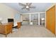 Carpeted bedroom with loft views and wooden desk and dresser at 1673 Woodmoor Dr, Monument, CO 80132