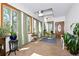 Bright foyer with brick floor, skylight, and large windows bringing in natural light at 1673 Woodmoor Dr, Monument, CO 80132