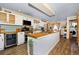 Charming kitchen with white cabinets, butcher block countertops, and stainless steel appliances at 1673 Woodmoor Dr, Monument, CO 80132