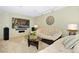 Spacious living room with plush sofas, glass coffee table, and a large flat-screen television at 1673 Woodmoor Dr, Monument, CO 80132