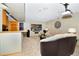 Open living area with a bar, comfortable seating, and entertainment setup with mounted projector at 1673 Woodmoor Dr, Monument, CO 80132