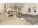 Spacious living room with high ceilings, a staircase, and an abundance of natural light at 1673 Woodmoor Dr, Monument, CO 80132